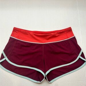 Orange, maroon, and teal lululemon speed up shorts